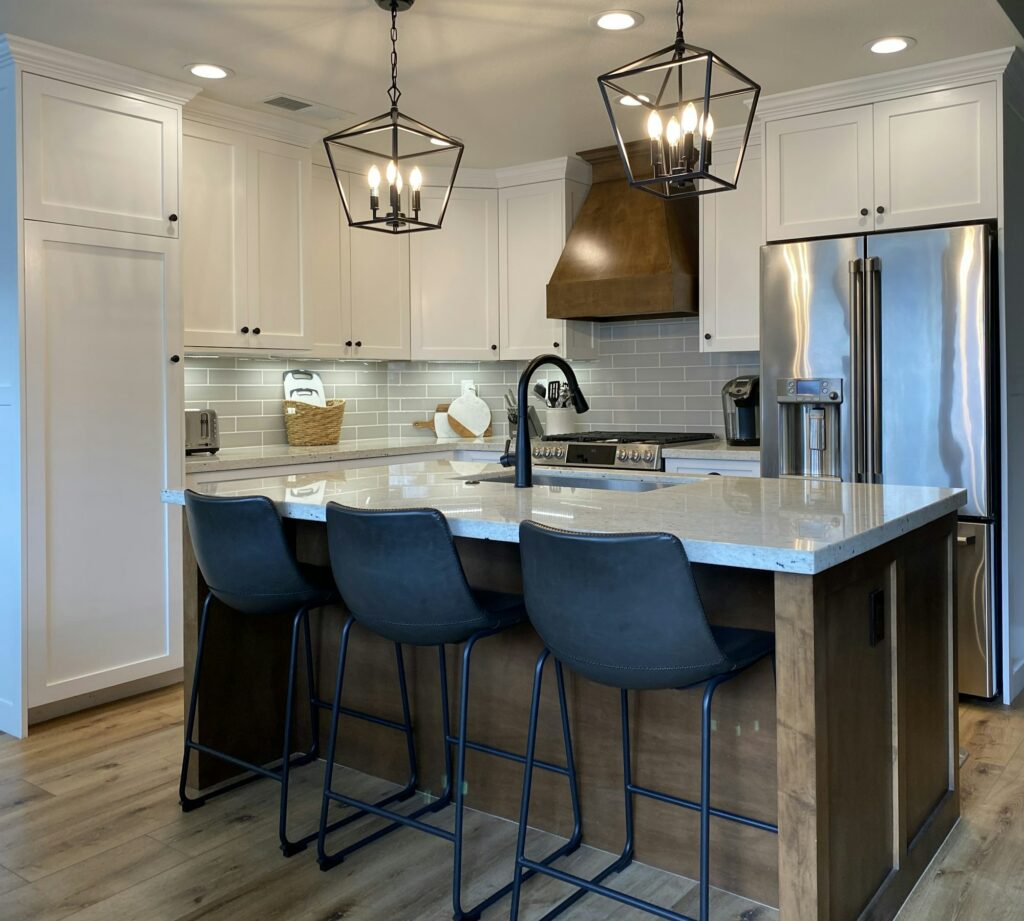 Small Farmhouse kitchen. Remodel Pendant lights white cabinets & granite countertops.