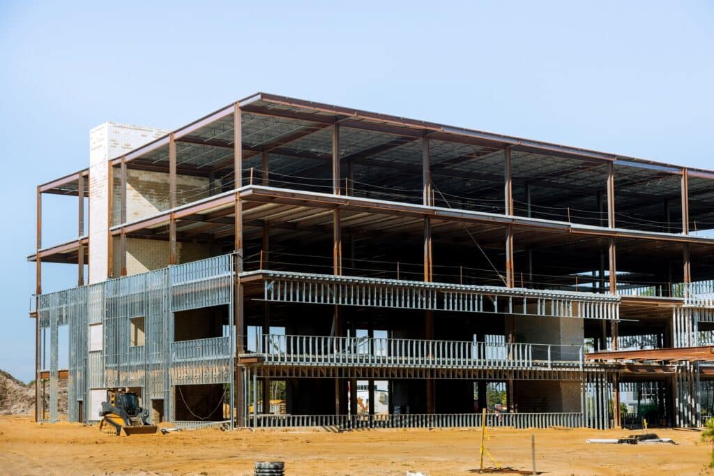 Building under construction with structural steel beam