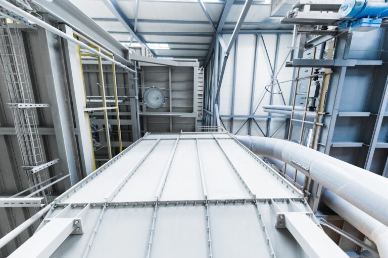 Fiberglass production industry equipment at manufacture background